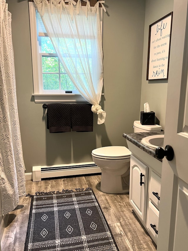 17 Fieldstone Dr, Bangor, ME 04401 - bathroom with baseboard heating, wood finished floors, and vanity