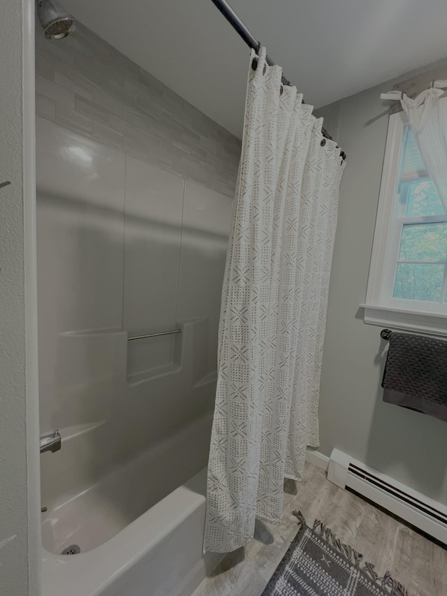 17 Fieldstone Dr, Bangor, ME 04401 - full bathroom featuring baseboard heating, shower / bath combo, and wood finished floors