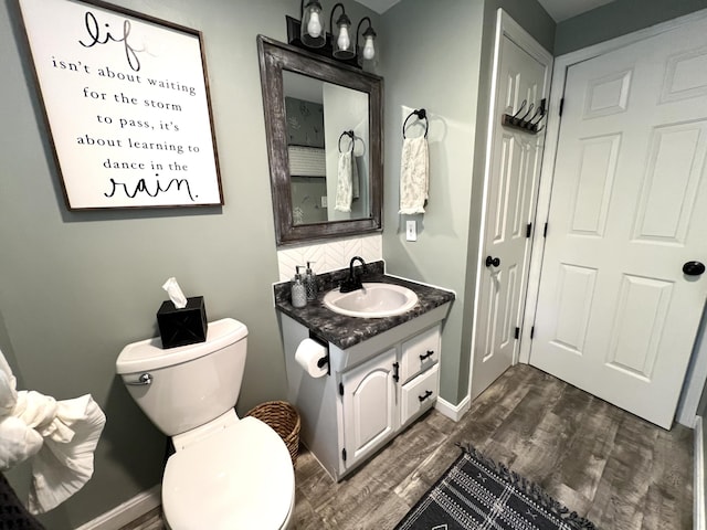 17 Fieldstone Dr, Bangor, ME 04401 - bathroom with vanity, wood finished floors, and backsplash