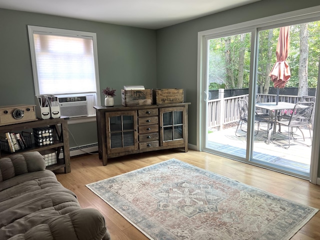 17 Fieldstone Dr, Bangor, ME 04401 - living area with a baseboard heating unit, wood finished floors, and cooling unit