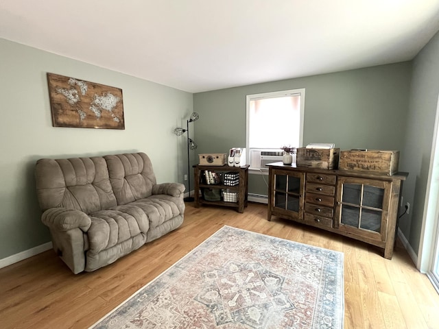 17 Fieldstone Dr, Bangor, ME 04401 - living room with a baseboard radiator, wood finished floors, and cooling unit
