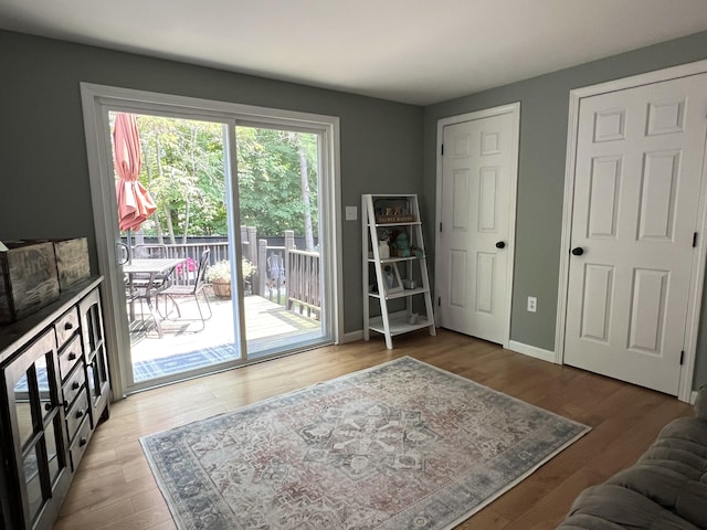 17 Fieldstone Dr, Bangor, ME 04401 - bedroom with access to outside and wood finished floors