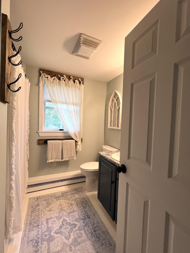 17 Fieldstone Dr, Bangor, ME 04401 - full bath with a baseboard heating unit, vanity, and curtained shower