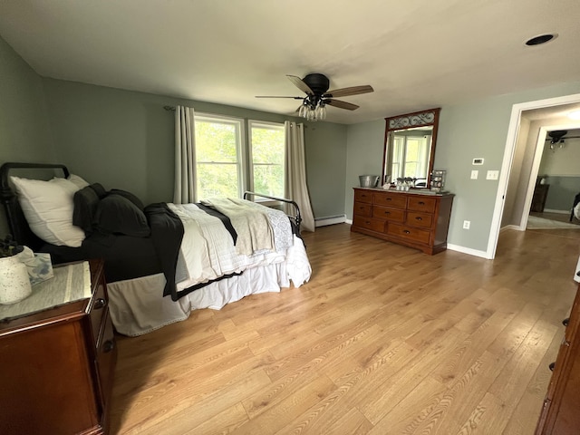 17 Fieldstone Dr, Bangor, ME 04401 - bedroom featuring light wood-style floors, a baseboard radiator, and a ceiling fan
