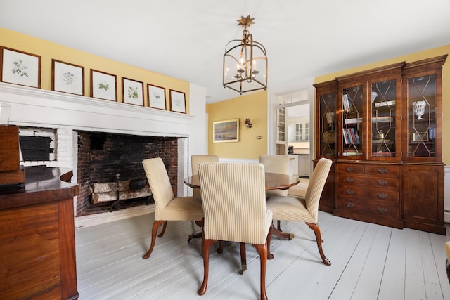 197A Perkins St, Castine, ME 04421 - dining space with a chandelier and light wood-style floors