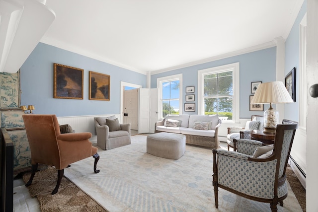 197A Perkins St, Castine, ME 04421 - living room with ornamental molding, baseboard heating, and wainscoting
