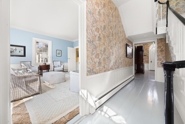 197A Perkins St, Castine, ME 04421 - hallway with a baseboard heating unit, wainscoting, stairway, and wallpapered walls