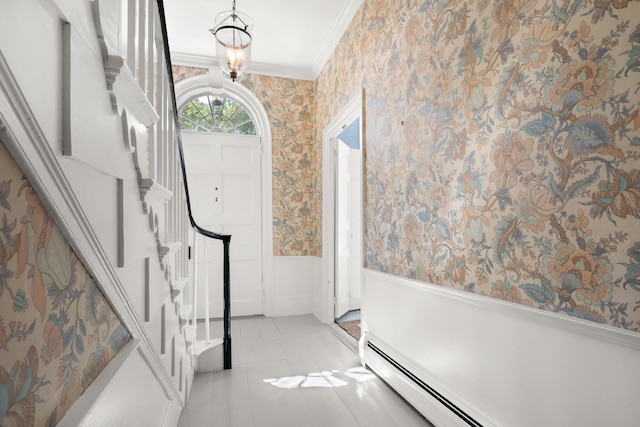 197A Perkins St, Castine, ME 04421 - entryway with wallpapered walls, a wainscoted wall, baseboard heating, crown molding, and stairs