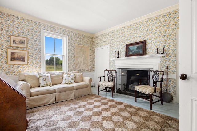 197A Perkins St, Castine, ME 04421 - living area featuring ornamental molding, a fireplace, wallpapered walls, and wood finished floors