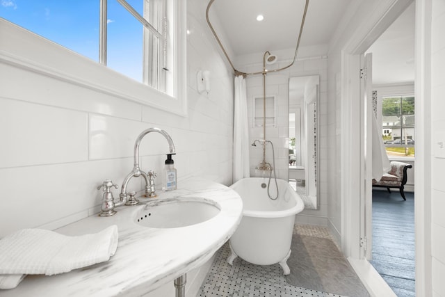 197A Perkins St, Castine, ME 04421 - full bathroom featuring a freestanding bath, tile walls, and a shower