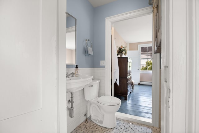 197A Perkins St, Castine, ME 04421 - half bath with wainscoting, baseboard heating, toilet, and tile walls