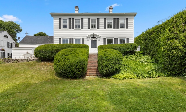 197A Perkins St, Castine, ME 04421 - colonial home featuring a front yard and a chimney