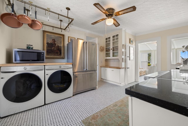 197A Perkins St, Castine, ME 04421 - laundry area with ceiling fan, separate washer and dryer, ornamental molding, and an ornate ceiling