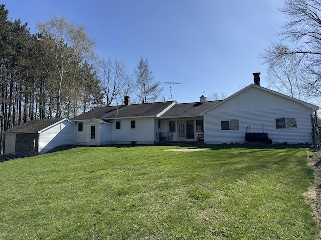 365 Snakeroot Rd, Pittsfield, ME 04967 - rear view of property featuring a chimney and a yard
