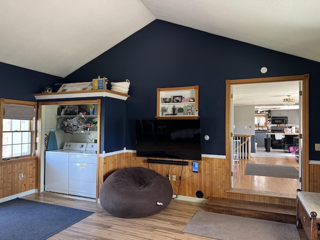 365 Snakeroot Rd, Pittsfield, ME 04967 - living area featuring separate washer and dryer, wood finished floors, and lofted ceiling