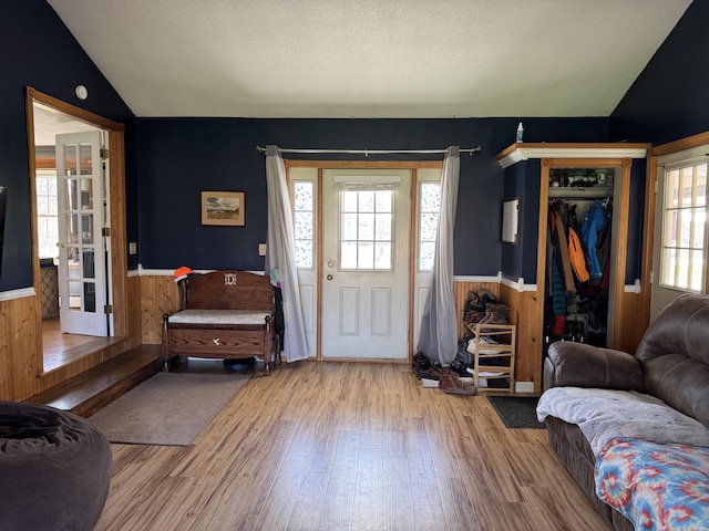 365 Snakeroot Rd, Pittsfield, ME 04967 - entrance foyer with a wainscoted wall, wood finished floors, and lofted ceiling
