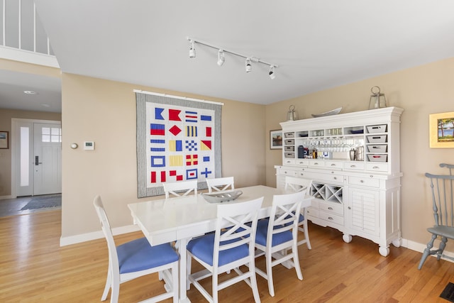 53 Jameson Point Rd Unit 24, Rockland, ME 04841 - dining area featuring rail lighting, light wood-type flooring, and baseboards