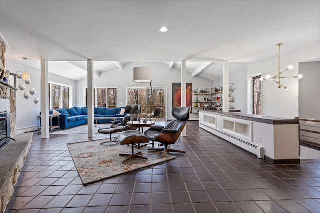 living area featuring a stone fireplace, a baseboard radiator, a chandelier, and vaulted ceiling