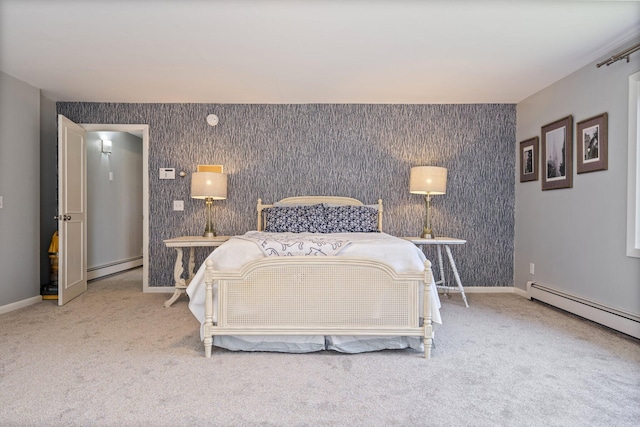 carpeted bedroom with baseboards, an accent wall, baseboard heating, and wallpapered walls