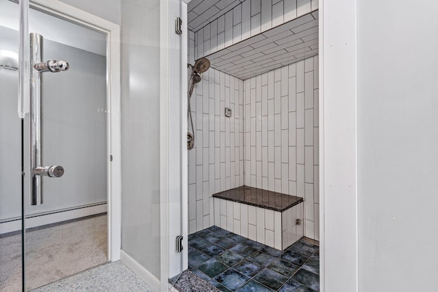 full bathroom with baseboards, a baseboard radiator, and a stall shower
