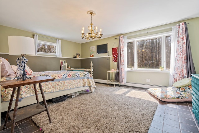 bedroom featuring carpet floors, baseboards, and a notable chandelier