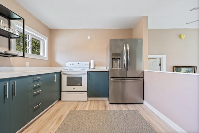 kitchen featuring white range with electric stovetop, stainless steel fridge, light wood finished floors, and open shelves