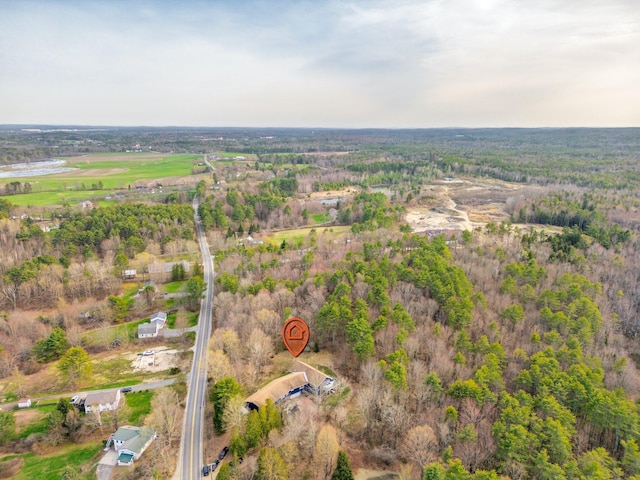 aerial view featuring a wooded view