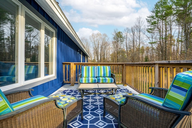 wooden terrace featuring outdoor lounge area