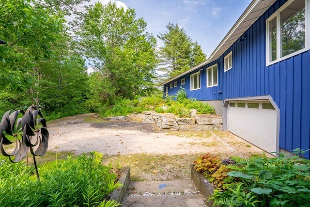 314 Meadow Rd, Topsham, ME 04086 - view of yard featuring a garage and dirt driveway