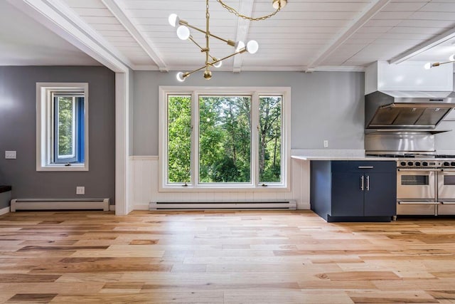 314 Meadow Rd, Topsham, ME 04086 - kitchen with a baseboard radiator, baseboard heating, double oven range, plenty of natural light, and a wainscoted wall