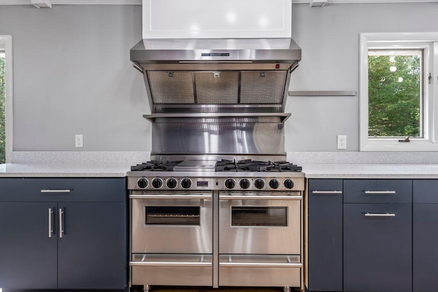 314 Meadow Rd, Topsham, ME 04086 - kitchen featuring double oven range, light countertops, and wall chimney range hood