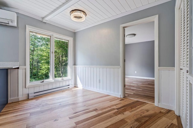 314 Meadow Rd, Topsham, ME 04086 - unfurnished room with a baseboard radiator, a wainscoted wall, a wall unit AC, light wood finished floors, and ornamental molding