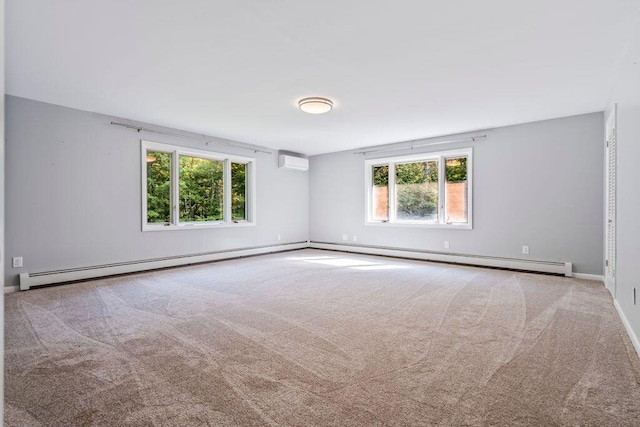 314 Meadow Rd, Topsham, ME 04086 - empty room with plenty of natural light, a wall mounted air conditioner, and carpet floors