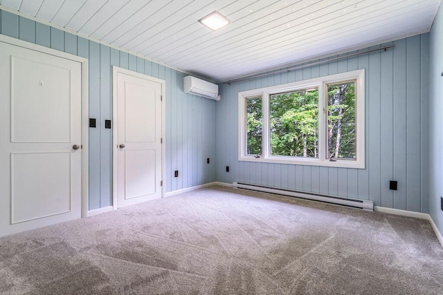 314 Meadow Rd, Topsham, ME 04086 - unfurnished bedroom featuring a baseboard radiator, an AC wall unit, carpet floors, wooden walls, and wooden ceiling