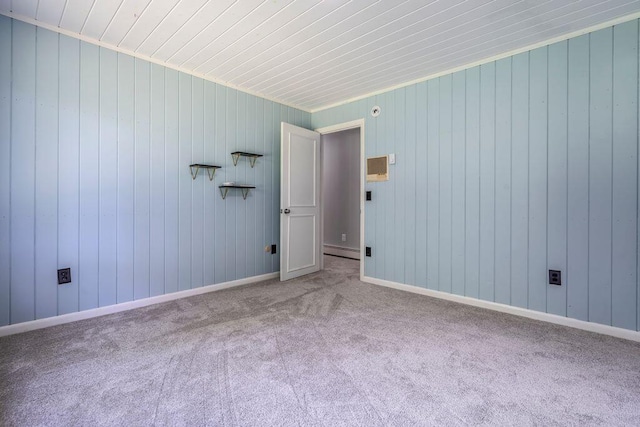 314 Meadow Rd, Topsham, ME 04086 - empty room with baseboard heating, carpet, and wooden walls