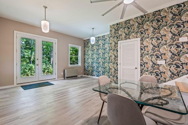 314 Meadow Rd, Topsham, ME 04086 - dining room with wallpapered walls, ceiling fan, wood finished floors, french doors, and an accent wall