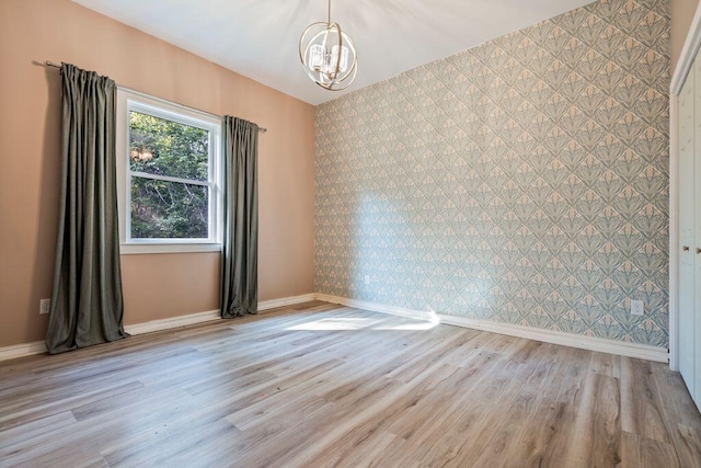 314 Meadow Rd, Topsham, ME 04086 - unfurnished room featuring a chandelier and light wood finished floors