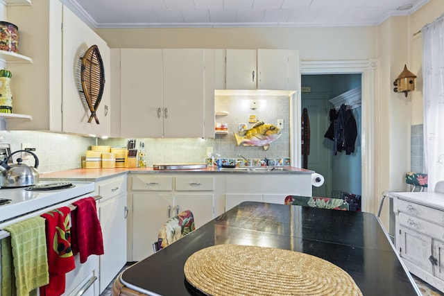 27 Townsend Ave, Boothbay Harbor, ME 04538 - kitchen with open shelves, backsplash, electric range, and white cabinetry