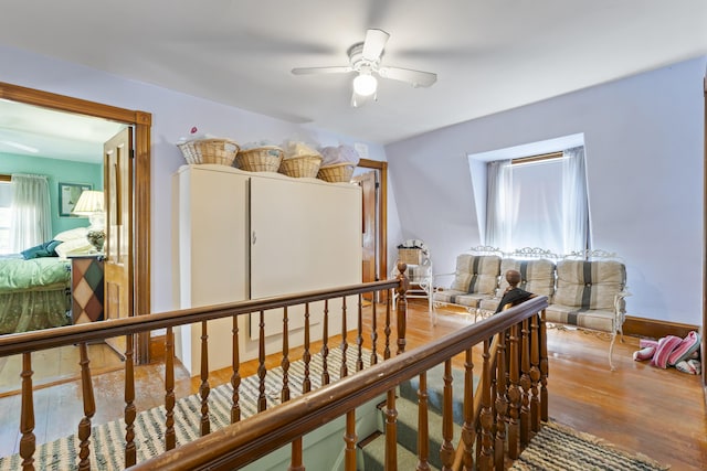 27 Townsend Ave, Boothbay Harbor, ME 04538 - corridor featuring plenty of natural light, wood finished floors, and an upstairs landing