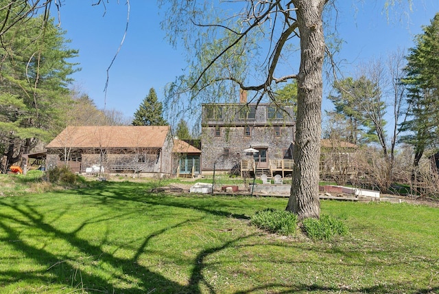 view of yard with a wooden deck