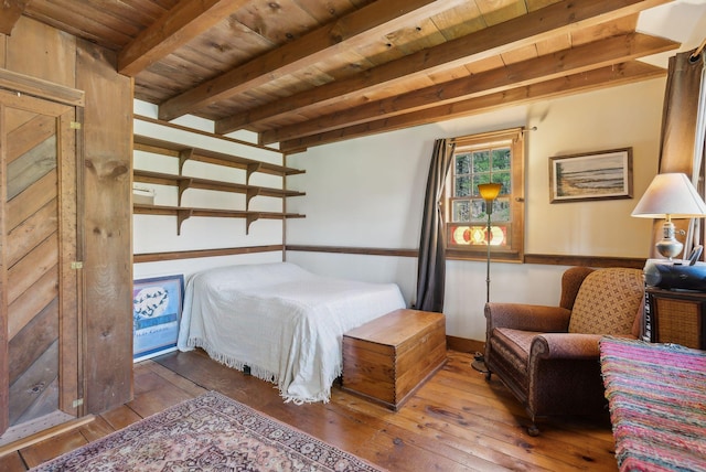 bedroom with wooden ceiling, baseboards, beamed ceiling, and hardwood / wood-style flooring