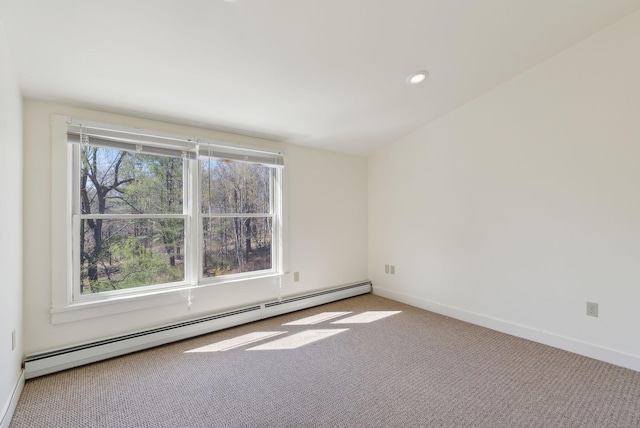 spare room featuring carpet floors, recessed lighting, baseboards, and a baseboard radiator