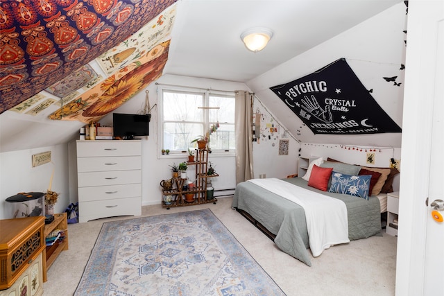 carpeted bedroom with vaulted ceiling and a baseboard heating unit