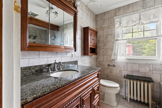 175 Summer St, Auburn, ME 04210 - full bath featuring radiator heating unit, vanity, tile walls, a shower, and tile patterned floors