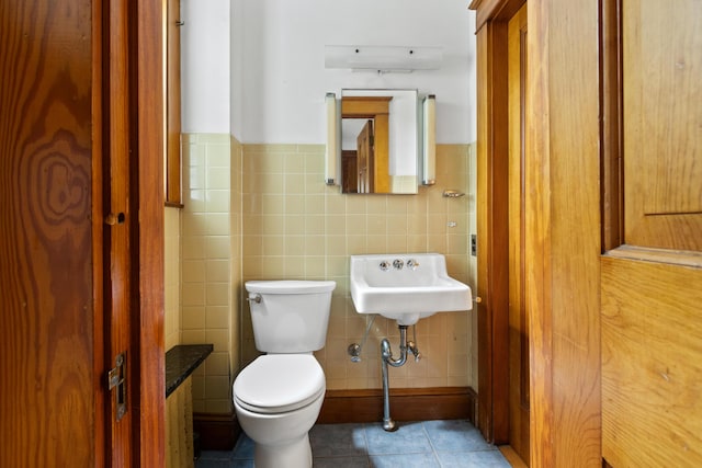 175 Summer St, Auburn, ME 04210 - half bathroom with tile walls, tile patterned flooring, and wainscoting