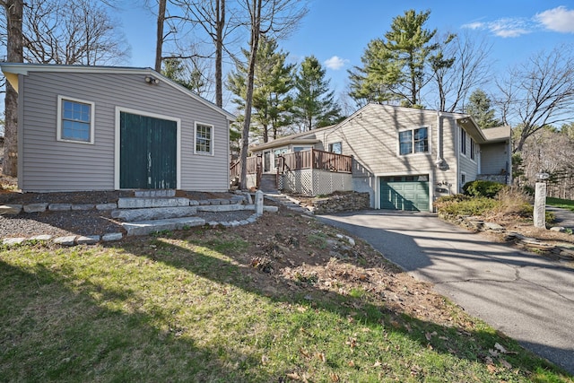 3 The Ledges St, Hallowell, ME 04347 - exterior space with entry steps, a wooden deck, an attached garage, and driveway
