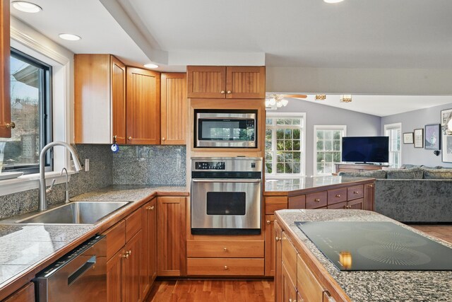 3 The Ledges St, Hallowell, ME 04347 - kitchen with appliances with stainless steel finishes, a sink, a ceiling fan, open floor plan, and wood finished floors