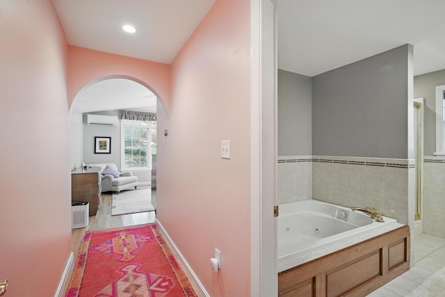 3 The Ledges St, Hallowell, ME 04347 - full bathroom with a whirlpool tub, baseboards, and a wall mounted AC