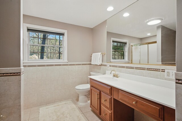 3 The Ledges St, Hallowell, ME 04347 - bathroom with a stall shower, toilet, tile walls, and a wainscoted wall