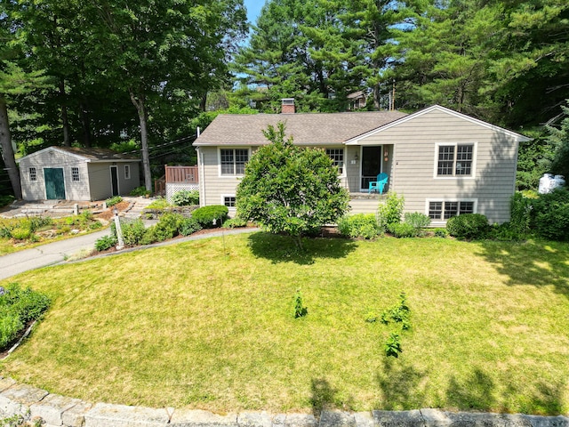 3 The Ledges St, Hallowell, ME 04347 - view of front facade with an outbuilding, a front lawn, and a chimney